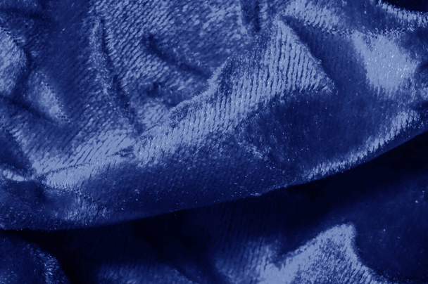 Mavi renkli Kadife kumaşın dokuma desenli kadife kumaşı lüksle eş anlamlıdır. Kadifenin en karakteristik özelliklerinden biri yumuşak tüylü yığını kadifeyi yumuşakça zengin kılar. - Fotoğraf, Görsel