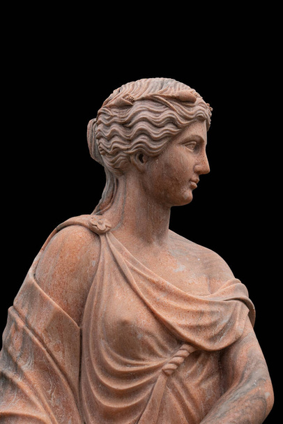 Clay head of an ancient Greek goddess isolated on black background - Fotoğraf, Görsel