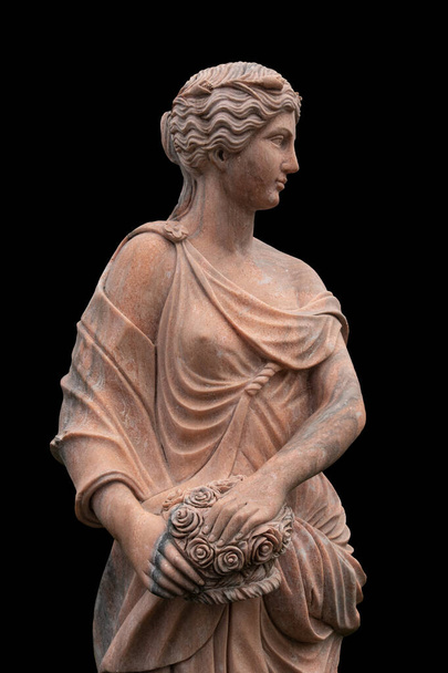 Clay statue of an ancient Greek goddess isolated on black background - Photo, Image