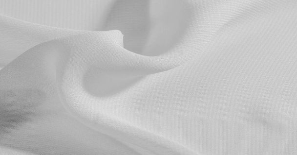 Fondo, patrón, textura, papel pintado, tela de seda blanca tiene un brillo brillante. Este es el tejido más versátil. Sea creativo con hermosos acentos de su diseño
. - Foto, imagen