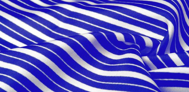silk striped fabric. blue white stripes. This beautiful, super soft, medium-sized silk blend is perfect for your design projects. It is brushed on the back for a luxurious feeling. - Photo, Image
