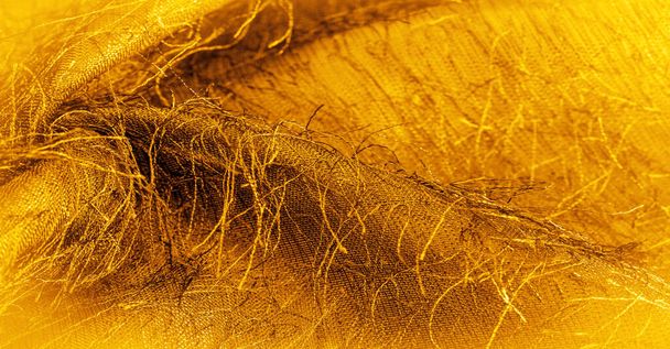 Texture de fond, ornement décoratif, tissu de soie or jaune, fils tissés sur le tissu, effet moelleux, sensation, apparence ou texture d'une surface ou d'une substance - Photo, image