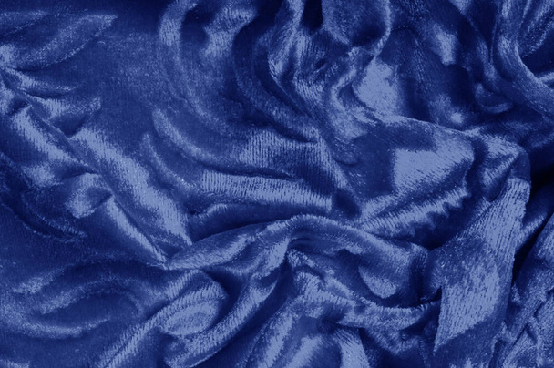 Υφή μοτίβο βελούδο ύφασμα από μπλε χρώμα Velvet είναι συνώνυμο με την πολυτέλεια Μία από τις πιο χαρακτηριστικές ιδιότητες του βελούδου είναι μαλακό χνουδωτό σωρός του Pile κάνει βελούδο λεία πλούσια σε υφή - Φωτογραφία, εικόνα
