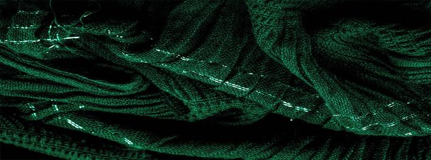A textura da imagem de fundo a cor do tecido sob a água, tecido ondulado verde-azul, tecido com dobras paralelas ou diagonais com dobras serrilhadas; produtos de tal tecido. - Foto, Imagem