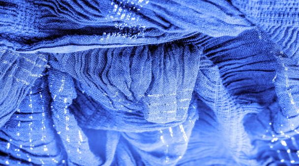 Текстура фонового малюнка, орнамент декору, сапфірова синя гофрована тканина, тканина з паралельними або діагональними складками з зубчастими складками; вироби з такої тканини
. - Фото, зображення