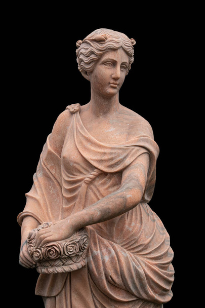 Clay statue of an ancient Greek goddess isolated on black background - Photo, Image