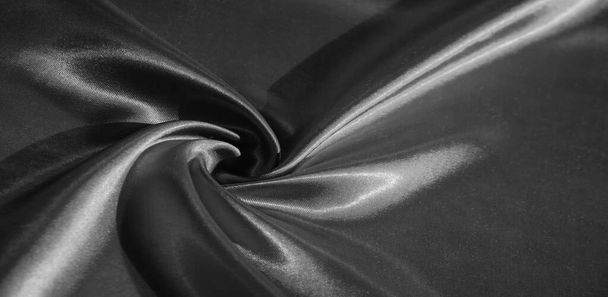 Texture, fond, motif, tissu en soie noir. Ce tissu adorable, doux et brillant a une surface lisse de vison, parfait pour créer vos projets. - Photo, image