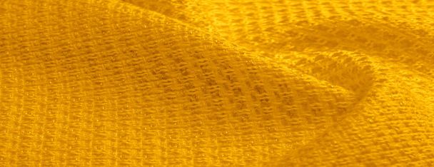 Background texture, pattern. Yellow fabric with metallic sequins. This beautiful lightweight sequined fabric has notes, sequined accents and a beautiful design. It also has a nice sheen. - Photo, Image