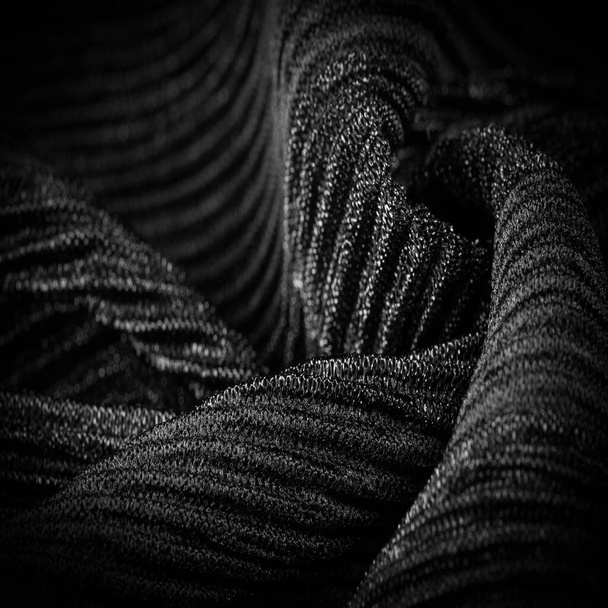 Textura, fundo, padrão, Crepe preto, é um tecido de seda, lã ou fibras sintéticas com uma aparência nitidamente clara, frisada
.  - Foto, Imagem