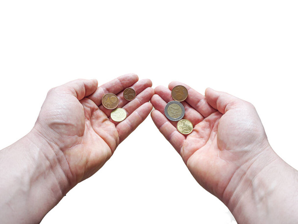 δύο χέρια με κέρματα ευρώ απομονωμένα σε λευκό φόντο. - Φωτογραφία, εικόνα