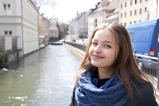 Portrait of a young confident woman on a sunny spring day in Augsburg's artists' quarter - Part 10 - Photo, Image