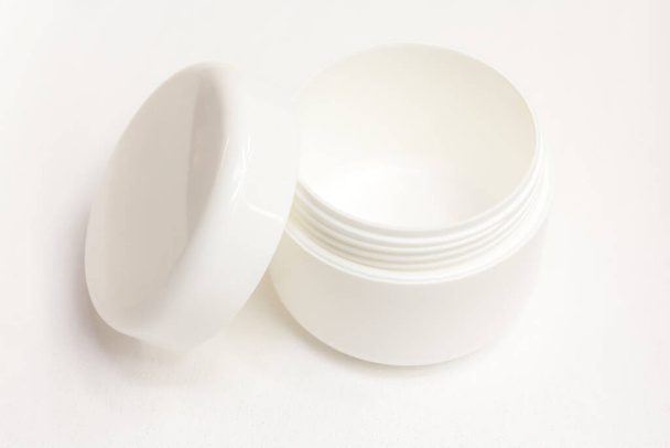 A cream can insulated against a white background - Foto, afbeelding