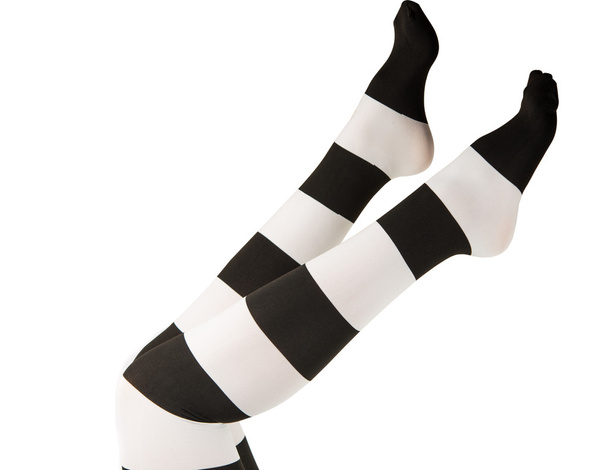 panty's in zwarte en witte strepen op de benen meisjes - Foto, afbeelding