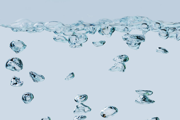 Vista en formato completo de burbujas de aire en aumento en el medio del agua sobre un fondo azul claro
. - Foto, imagen