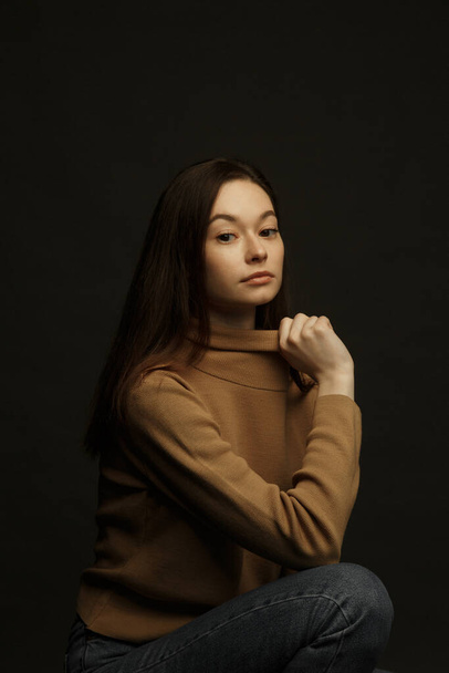 Professional model and posing. Model tests of a girl in a Studio with a black background.  - Foto, Bild