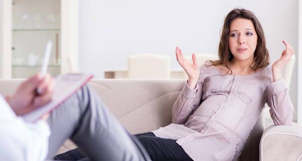 Pregnant woman visiting psychologist doctor - Фото, изображение