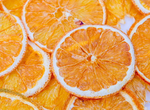 Padrão organizado com fatias de laranja secas
 - Foto, Imagem
