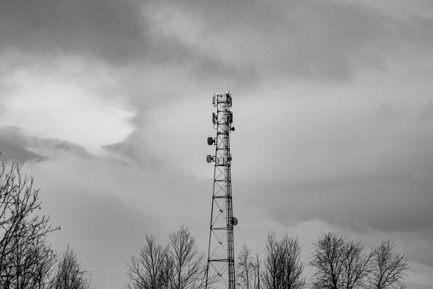 a mobile and Internet communications tower located in a forest far from settlements - Fotó, kép