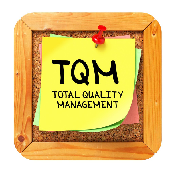 TQM. Yellow Sticker on Bulletin. - Photo, Image