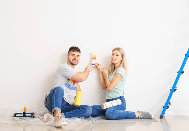 Young couple choosing color of wall - Photo, Image