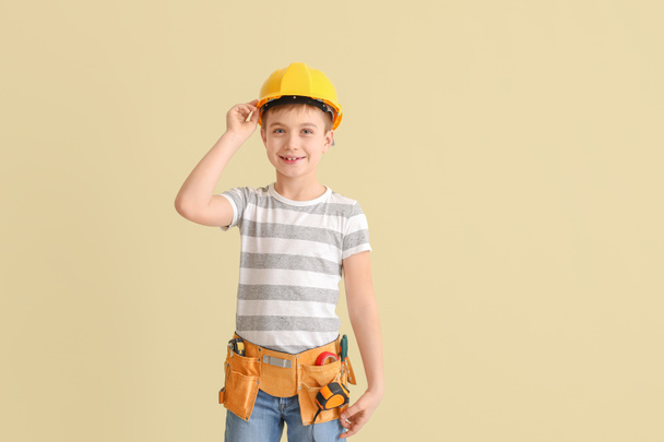 Cute little architect on light background - Foto, afbeelding