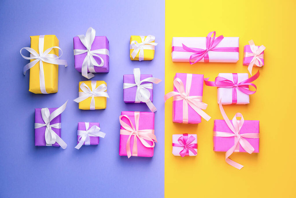 Many Birthday gifts on color background - Foto, imagen