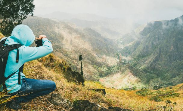 Traveler takes a picture of a gorgeous panorama view of a lush green Xo-xo valley. Santo Antao island in Cabo Verde - Valokuva, kuva