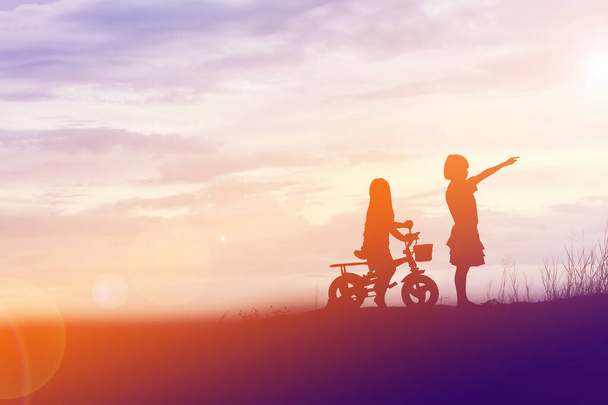 two little girls bike silhouette - Photo, Image