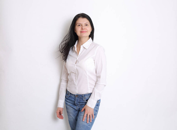 Caucasian woman studio portrait posing as a model. Woman in white elegant blouse. - Φωτογραφία, εικόνα