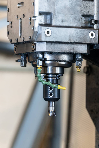 Spindle with a milling cutter in a mandrel on a CNC milling machine. - Photo, Image