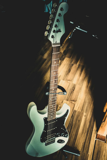 View of a black and white vintage guitar - Φωτογραφία, εικόνα