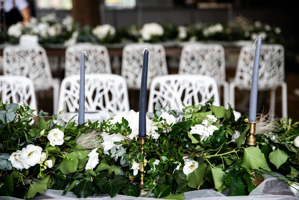 Festive banquet decorated with green branches - Φωτογραφία, εικόνα