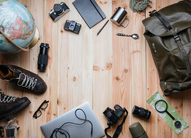 Creative layout of vintage and modern photography equipment nicely organized on light raw wooden planks background. Photographer, work and travel, concept. Trendy flat lay with copy space. - Photo, Image