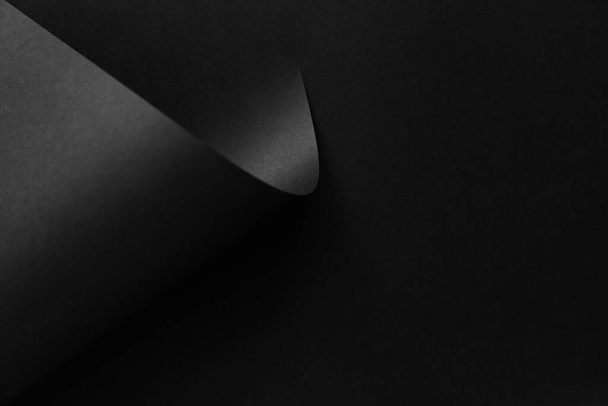 Black folded abstract paper minimalist style background. Fashion trending backdrop. - Fotografie, Obrázek