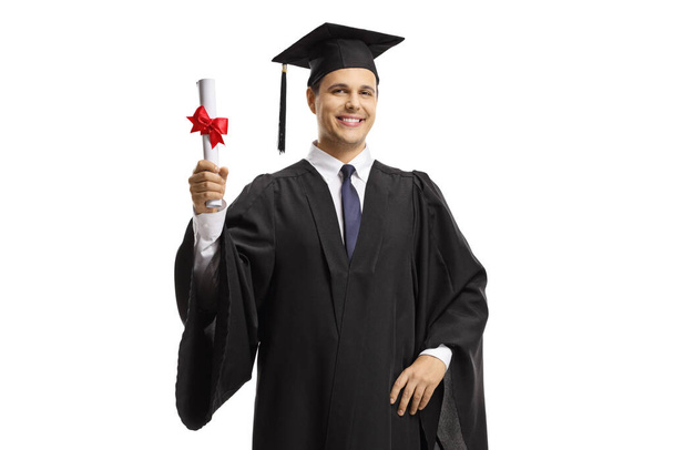 Male graduate holding a diploma isolated on white background - Fotó, kép