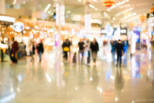 Blurred crowd of people walking in airport hall or shopping mall - Photo, Image