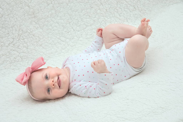 Adorable Baby Girl with Pink Hair Band Posing on Photoshoot - Photo, image