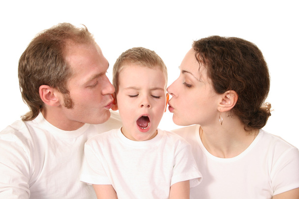 Yawn boy with kissing parents - Zdjęcie, obraz