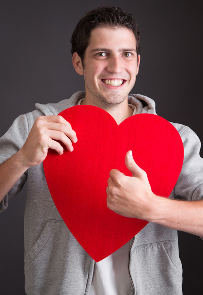 Man with heart thumbs up - Foto, Imagen