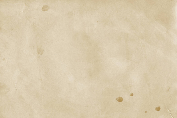 Old paper background with copy space. Paper colored with coffee or tea. - Photo, Image