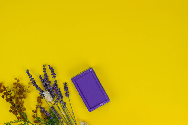 Natural Lavander soap with dried aroma Lavander on the yellow background. Organic and bio concept.  - Foto, Bild