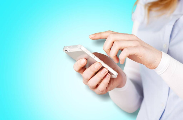 female hands with smartphone on  background  - Φωτογραφία, εικόνα
