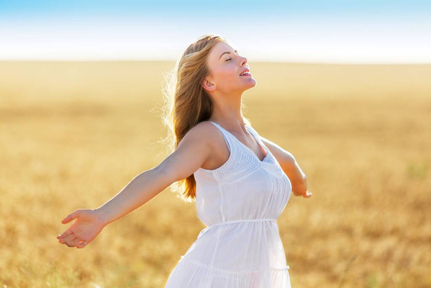 Happy woman on wheat field   - Foto, Imagen