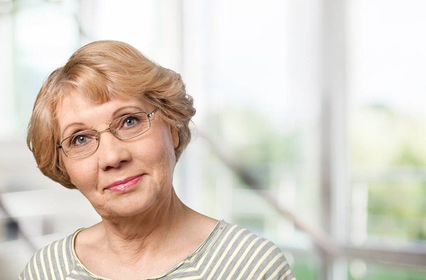 portrait of mature woman smiling at camera  - Photo, image