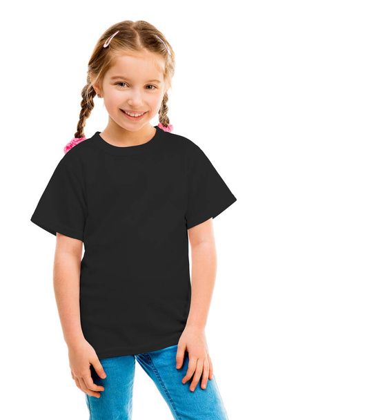 cute little girl in a black T-shirt and blue jeans - Fotoğraf, Görsel