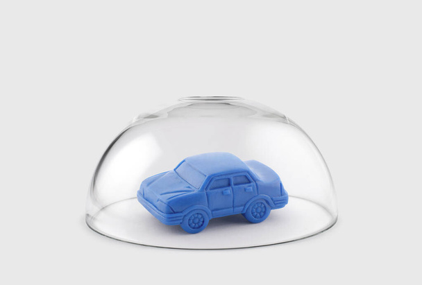 Blue toy car protected under a glass dome - Foto, Imagem