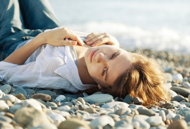 beautiful young woman lying on the beach - Photo, image
