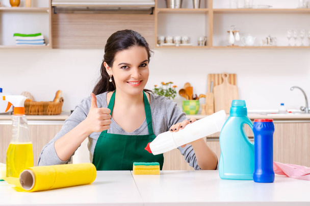 Young female contractor doing housework - Photo, Image