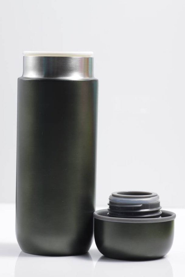 metallic black insulated tumbler on a white isolated background - Fotoğraf, Görsel