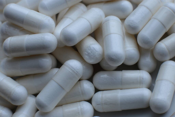 Mode medische macro foto achtergrond pillen en capsules - Foto, afbeelding